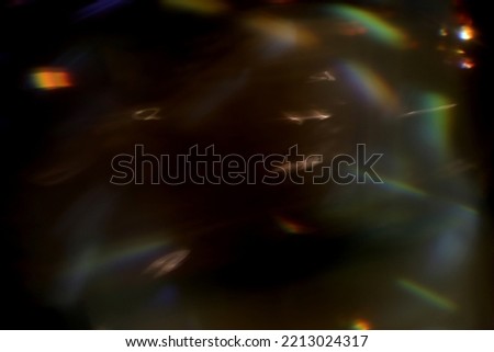Abstract lens flare light over black background. Lens flare lights. Bokeh Prism Light Flares Overlay on Black Background. abstract Bokeh Lights. light leak. natural light effects.