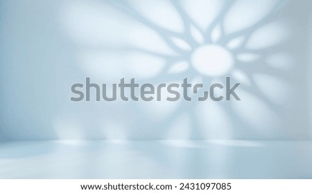 Abstract light blue background with beautiful shadow of Muslim ornament on the wall.