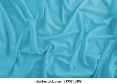 Abstract Light Blue Fabric Background With Wrinkles And Waves For Product Presentation