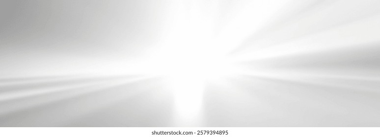 Abstract light burst with soft rays illuminating a white background.