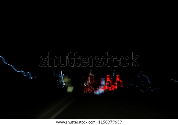 Abstract light from\
the car running at\
night.