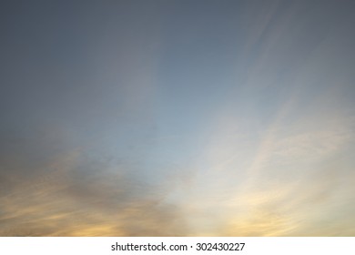 Abstract light cloud over yellow and blue sky background