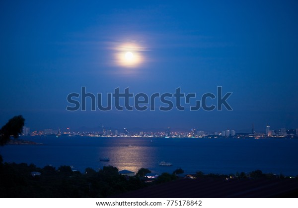 Abstract light of moon with night sea scape\
using as background or wallpaper\
concept.