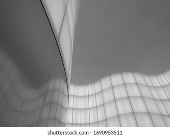 Abstract light pattern on interior wall in black and white.
