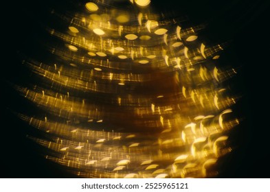 Abstract light patterns create a stunning golden effect in a circular arrangement during a nighttime exhibition in the city