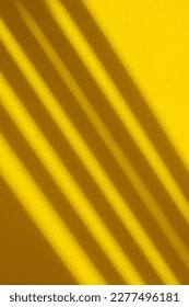 Abstract Of Light And Shadow Line Pattern On Yellow Concrete Wall Background