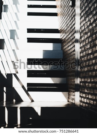 Similar – Schattenwurf an Ziegelwand mit geschlossenem Fenster im Schwung aufwärts