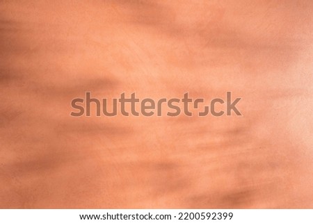 abstract light terracotta background. Copy space and shadows.
