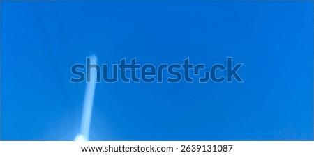 Abstract light trails on a deep blue background, creating vertical glowing lines in white, cyan, and red hues. #AbstractLights #ModernArt