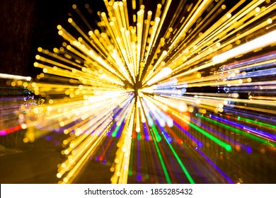 Abstract lightburst camera zoom movement yellow green purple lights