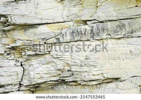 abstract limestone texture, relief of natural limestone rock with layers and cracks
