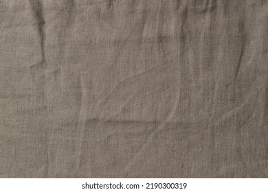 Abstract linen fabric texture background. Crumpled natural linen organic eco textiles canvas background. Top view