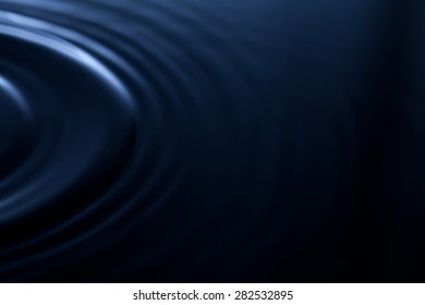 Abstract liquid waves. Dark blue background. Reflections in water. Ripple. plastic, rubber effect. soft focus - Shutterstock ID 282532895
