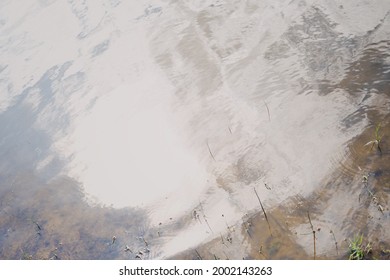 Abstract Low Contrast Background Image Of Water Reflections In Summer