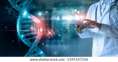 Abstract luminous DNA molecule. Doctor using tablet and check with analysis chromosome DNA genetic of human on virtual interface. Medicine. Medical science and biotechnology.