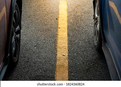 Abstract And Luxury Of Beside Two Car On Asphalt Road With Yellow Line In Center. Prepare For Race Or Stop In Parking Area.