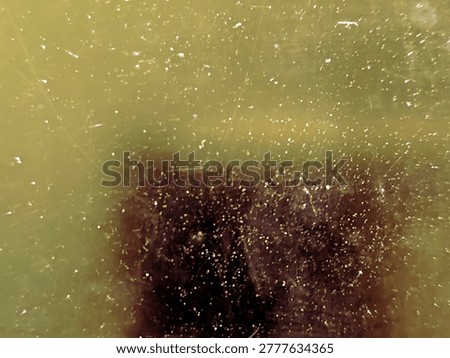 An abstract macro background with a warm off-white cosmic haze and countless sparkling golden specks surrounding a dark, blurry central void, creating a dreamlike nebula effect