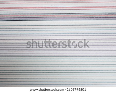 Abstract macro of the fore-edge, or side view, of a textbook 