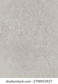 Abstract macro texture of a light beige stone surface with generic mottled pattern.