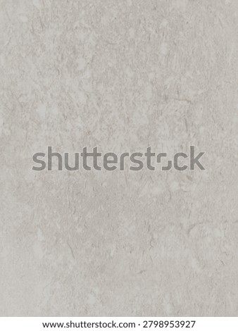 Abstract macro texture of a light beige stone surface with generic mottled pattern.