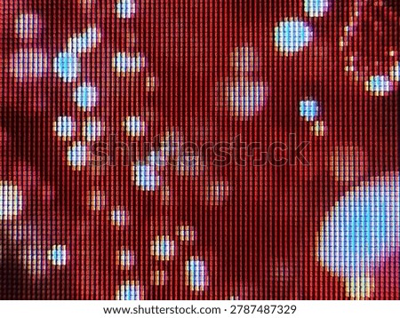 Abstract macro texture of a red LCD screen with bright blue pixel clusters, close-up of digital subpixels forming a glowing matrix grid pattern, futuristic electronic backdrop for tech design assets