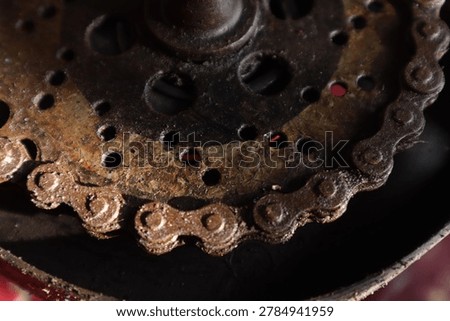 Abstract macro texture of a rusty and weathered bicycle sprocket chainring.