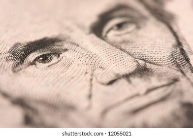 Abstract Macro Of U.S. Five Dollar Bill's Abraham Lincoln Face With Narrow Depth Of Field.