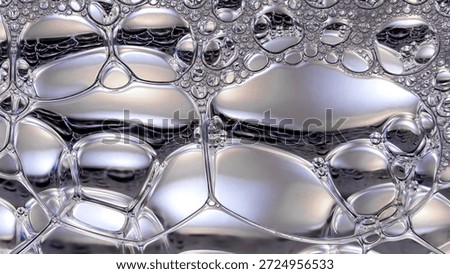 Abstract macro view of glossy bubbles and silky liquid textures, symbolizing hydrated skin, deep moisture, and smooth beauty serum surfaces with a clean background, luminous, and premium skincare aesthetic.