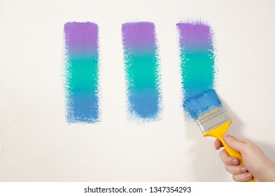 Abstract , man painting wall in various colors 