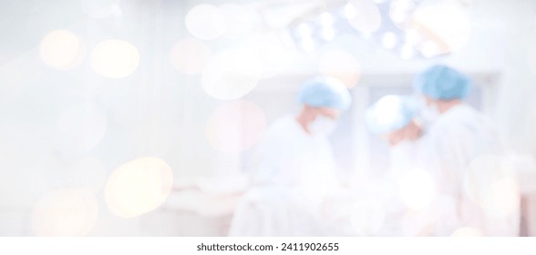 Abstract medical blurred background of operating room, patient lies on table, doctors working laparoscopy. - Powered by Shutterstock