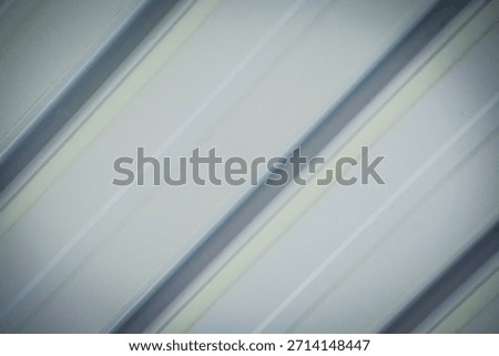 Abstract Metallic Texture of Soft Diagonal Lines: Neutral White and Grey Corrugation Pattern for Technology and Business.