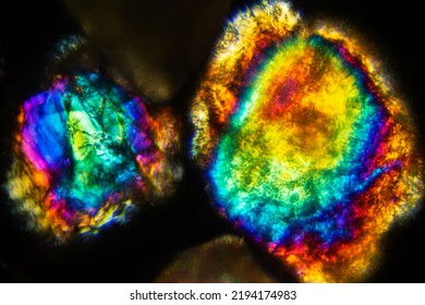 Abstract Micrograph With Brilliant Colors Of A Sand Grains From The Kenai Peninsula Of Alaska, Magnified With Polarization At About 200x.