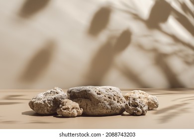 Abstract minimal nature scene - empty stage and composition of stones on beige background and soft shadows of tree leaves. Pedestal for cosmetic product and packaging mockups display presentation - Shutterstock ID 2088743203