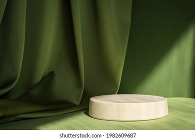 Abstract minimal scene with geometrical form. Cylinder podium on green background. Abstract background. Scene to show cosmetic podructs. Showcase, display case. 3d render.