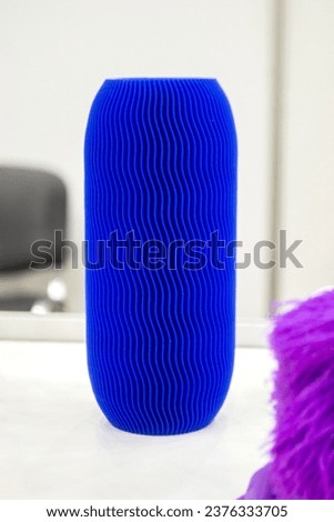 Abstract model printed on 3D printer. 3D printer created object from molten plastic. Modern three-dimensional printing technologies. 3D printer and 3D printing. Innovation additive robotic technology