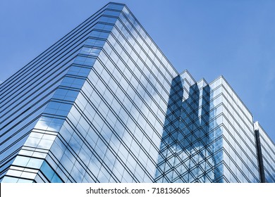 Abstract modern architecture background photo, office tower made of glass and steel - Shutterstock ID 718136065