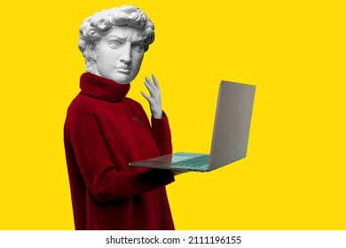 Abstract modern collage. The man with the plaster head of David in a red sweater looks at a laptop screen on a yellow background - Shutterstock ID 2111196155