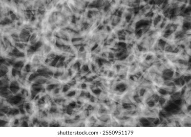 Abstract Monochrome Light Trails Texture with Chaotic Swirling Patterns in Black and White