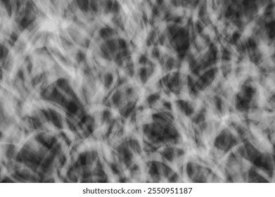 Abstract Monochrome Light Trails Texture with Chaotic Swirling Patterns in Black and White