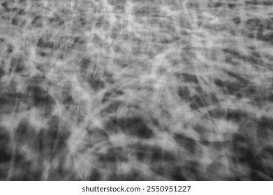 Abstract Monochrome Light Trails Texture with Chaotic Swirling Patterns in Black and White