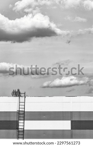 Abstract monochrome minimalist picture with a staicase leading to a dramatic sky.