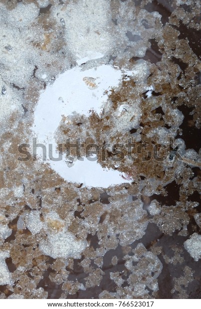 Abstract of the moon shadow, on  background  dirty
water in the water.
