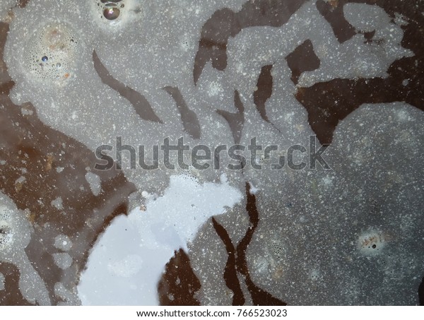 Abstract of the moon shadow, on  background  dirty\
water in the water.