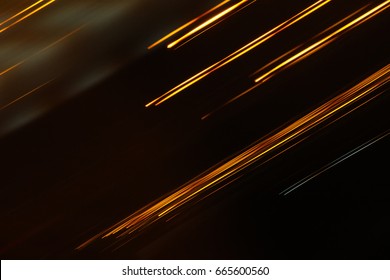 Abstract motion blur messy light trail. Blurred Night lights at street in city. For abstract background. Colored reflections. - Shutterstock ID 665600560