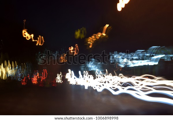 abstract motion blur messy light caused by the car\
on the road