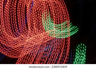 Abstract Motion Blur Patterns in Red and Green. Fusion of Colors: Abstract Motion Blur Patterns in Vibrant Red and Green Hues. Synchronized Chaos: Abstract Motion Blur Patterns in Red and Green

