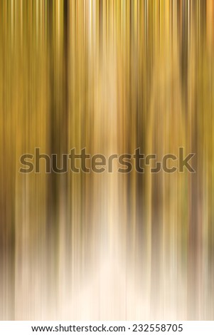 Abstract motion blur of trees in a forest with pastel colors