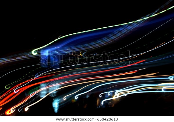 Abstract Motion picture from the light. The busy\
night in Bangkok