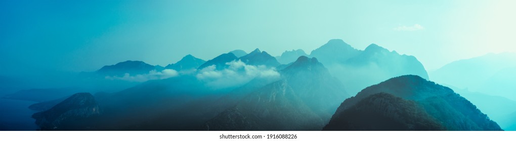 Abstract mountain background with copy space- concept of tourism and travel. Panorama of layers of ridges in Tunektepe Teleferik near Anntalia at sanrise sky