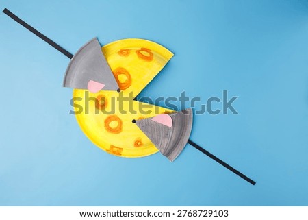 Abstract mouse and cheese composition made of paper. Minimalist concept for food industry, pest control services, financial savings metaphors, animation studios, or children publishing houses.